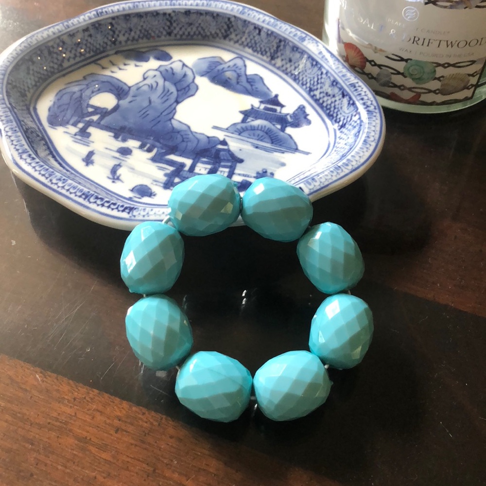 Turquoise colored plastic elastic bracelet